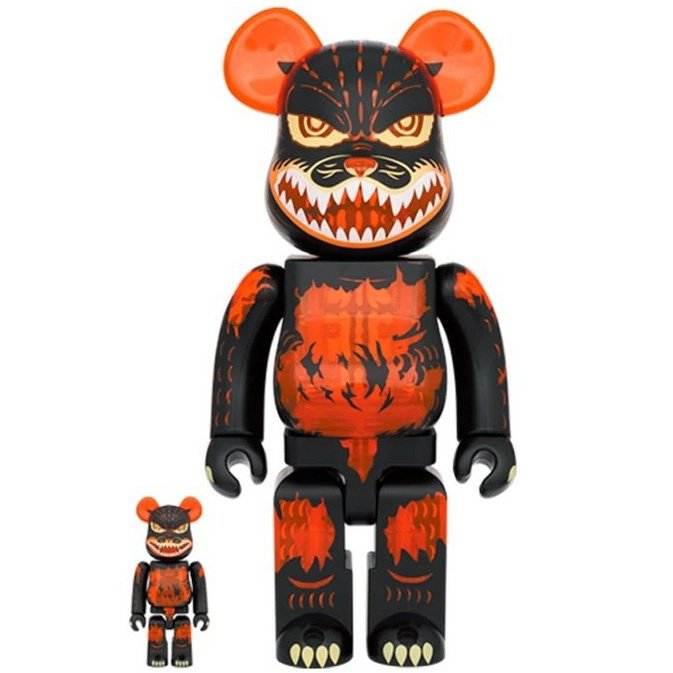 400 & 100 Bearbrick set featuring Melting Godzilla in clear orange with black and orange aggressive design