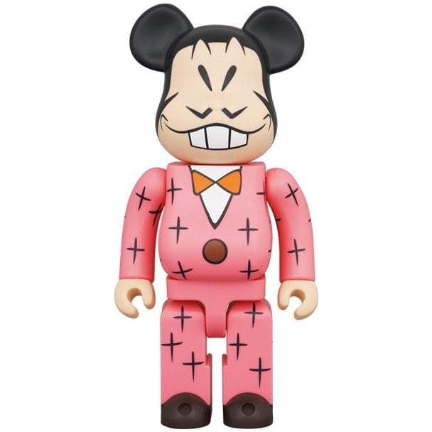 400% Bearbrick figure of Iyami character from Osomatsu series in pink suit with black cross patterns and orange bow tie