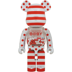 1000% Bearbrick My First Bearbrick Baby BWWT 3 special edition collectible with red and white striped design and transparent belly containing colorful beads.